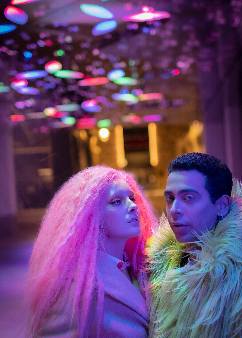 Couple under neon lights