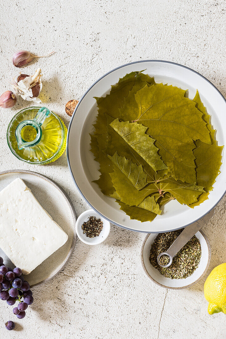 grape leaves, feta, grapes, and olive oil