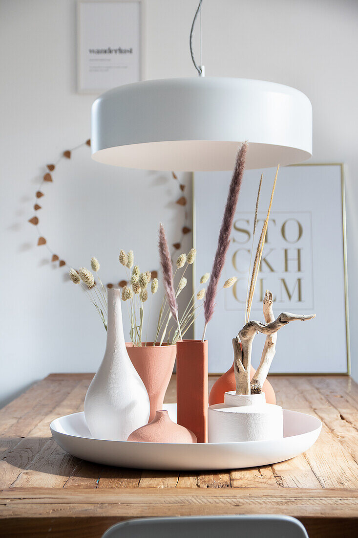 Vases painted with homemade chalk paint on a round tray