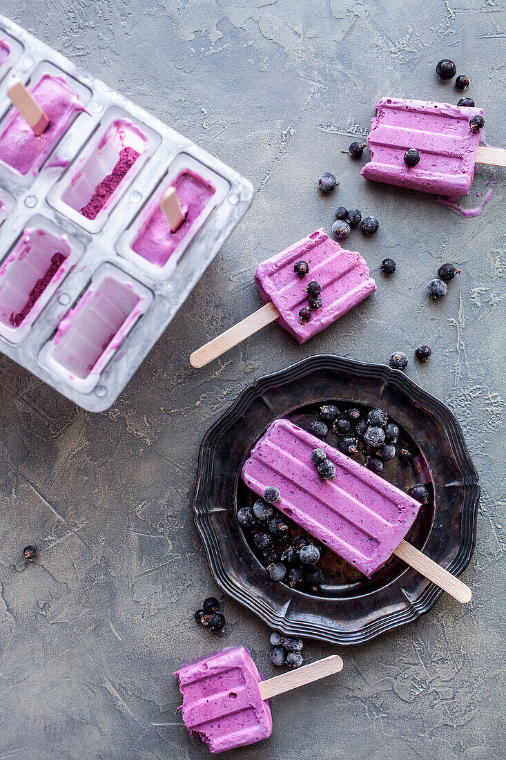 Homemade blackcurrant ice cream on a stick