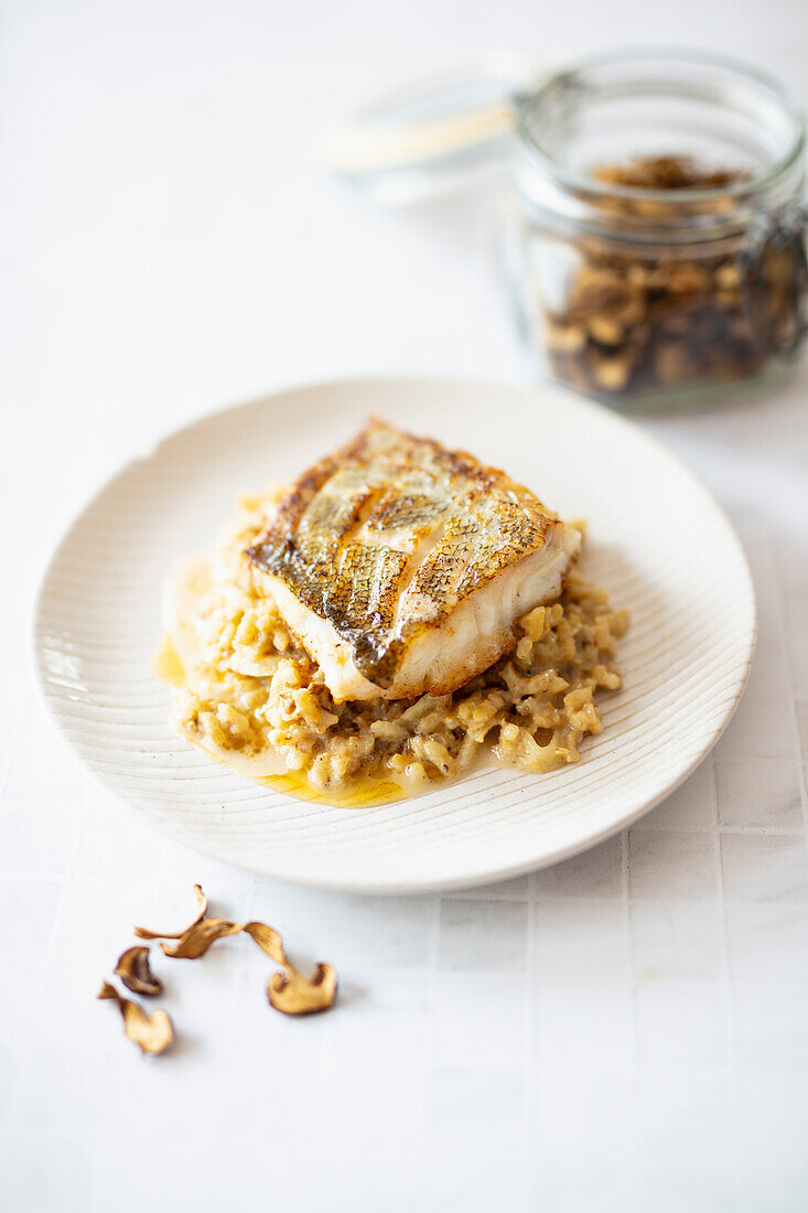 Cod on risotto with dried porcini mushrooms and fennel