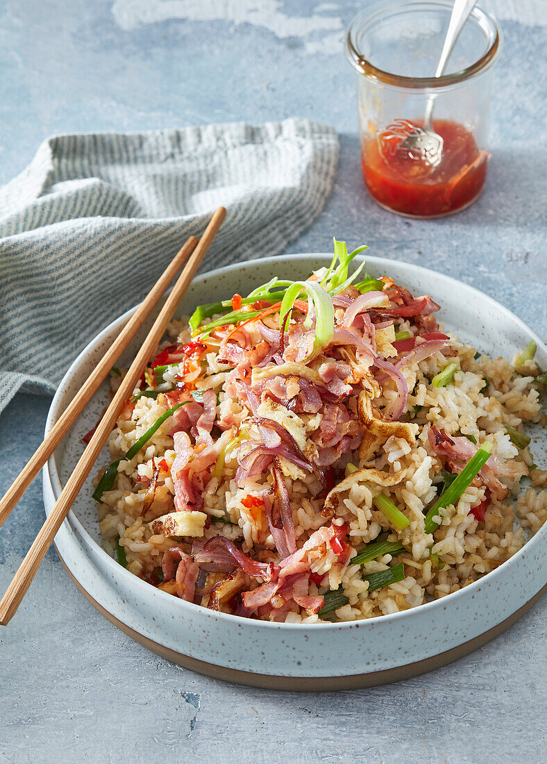 Fried rice with striped bacon and omelet