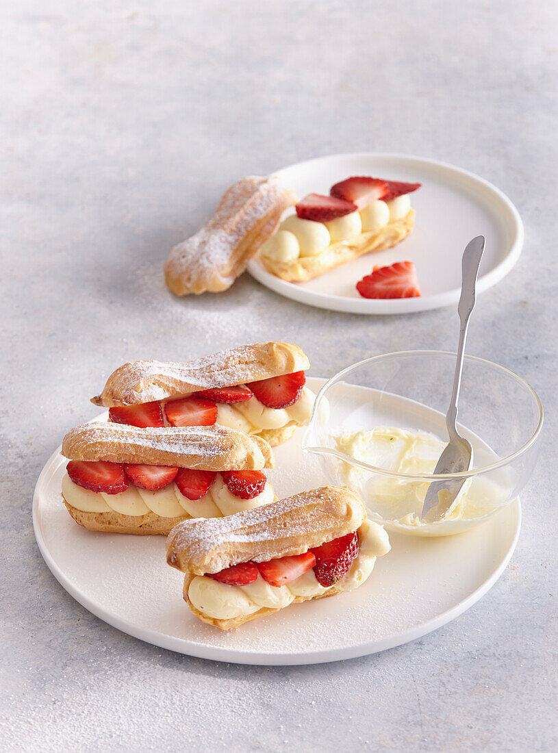 Eclaires with vanilla mousse and strawberries