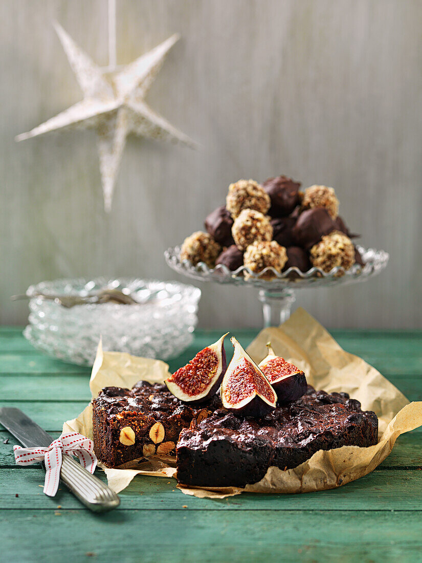 Chocolate cake with fruit and nuts, figs, truffels with cocolate and nuts
