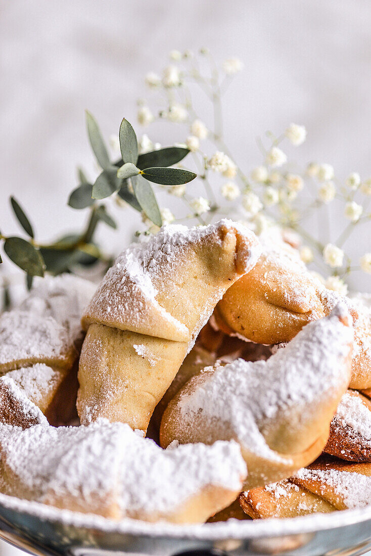 Croissants with rose filling sprinkled with powdered sugar