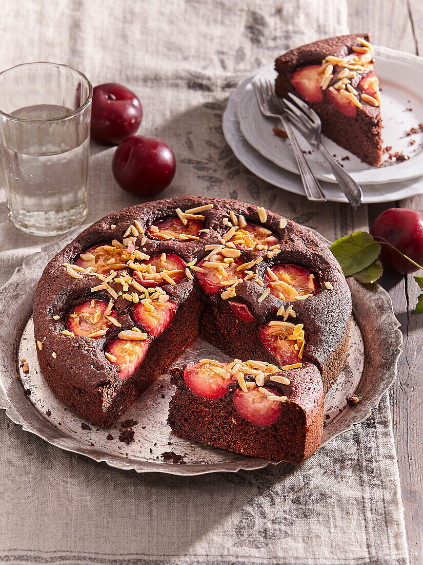 Chocolate and almond cake with red plums