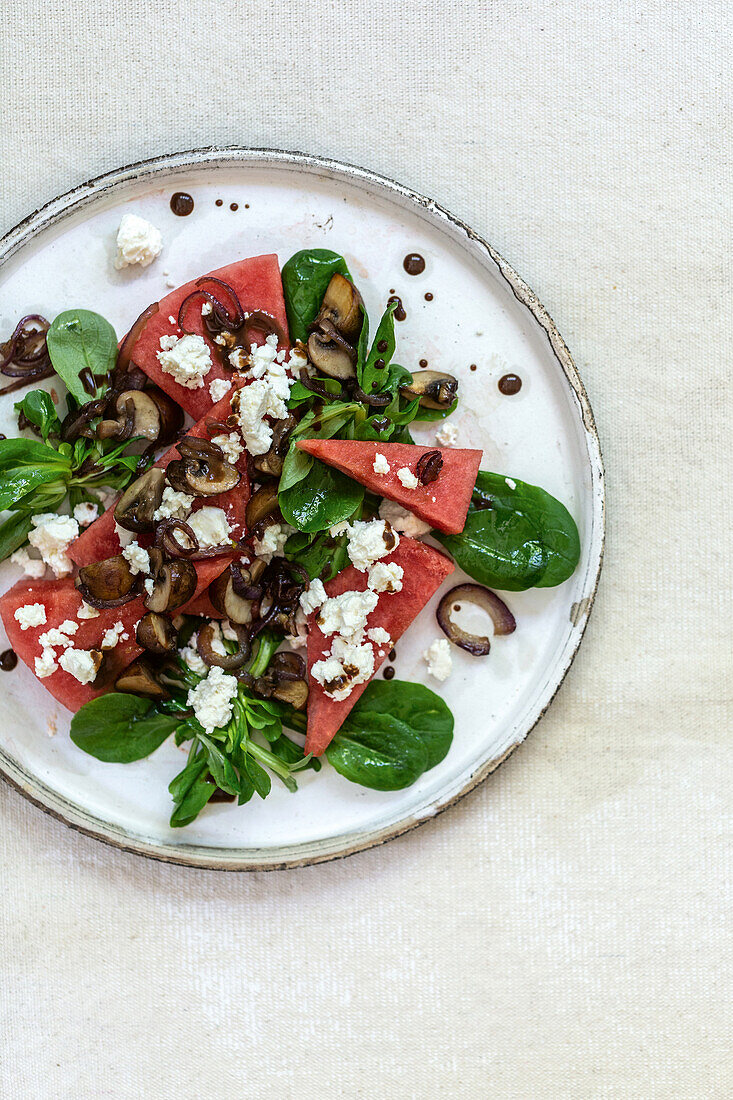 Watermelon salad with mushrooms and feta cheese