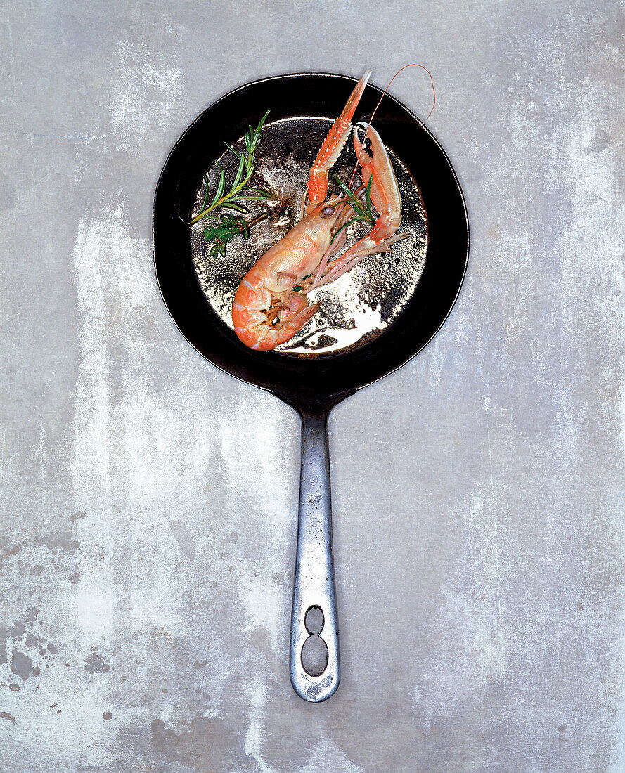 Norway lobster with herbs in the pan