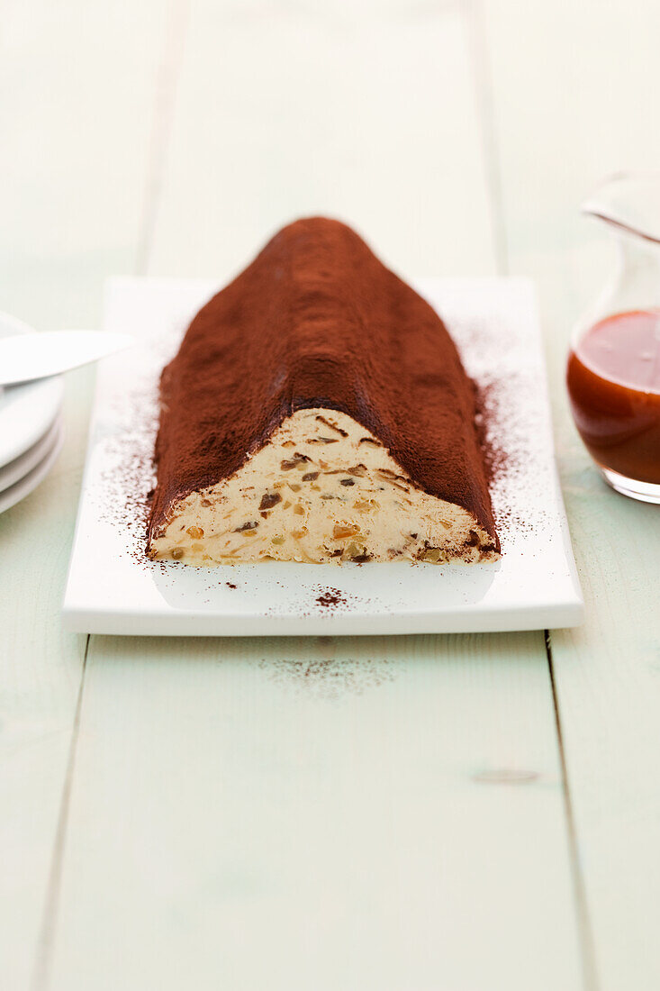 Iced Christmas stollen with cocoa powder