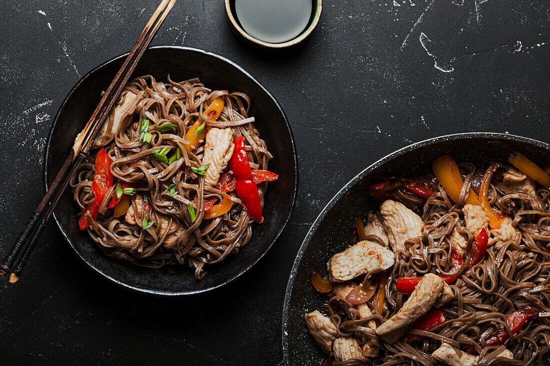 Bowl with Asian chicken stir fry soba noodles with vegetables