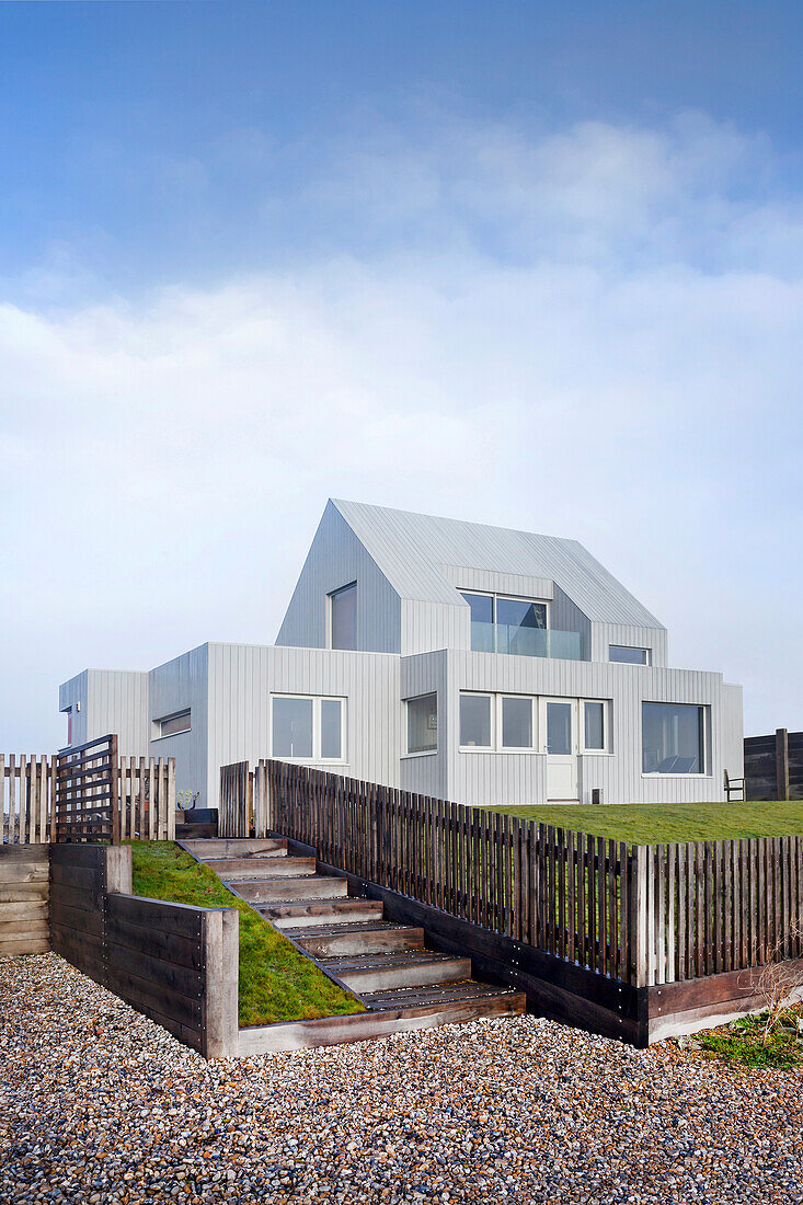 Modern detached house with light wood panelling