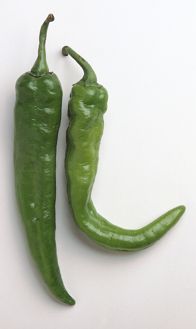 Two green anaheim chillies