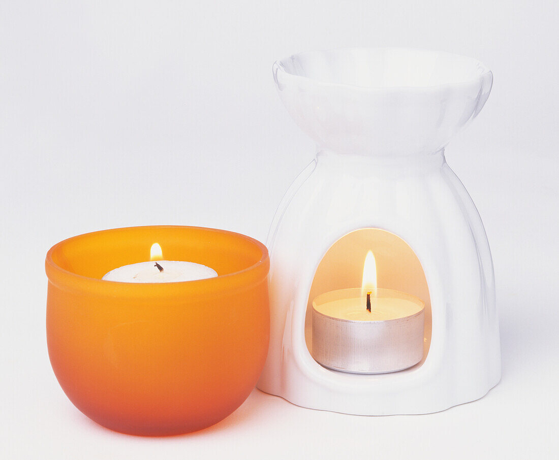 Two lit scented candles