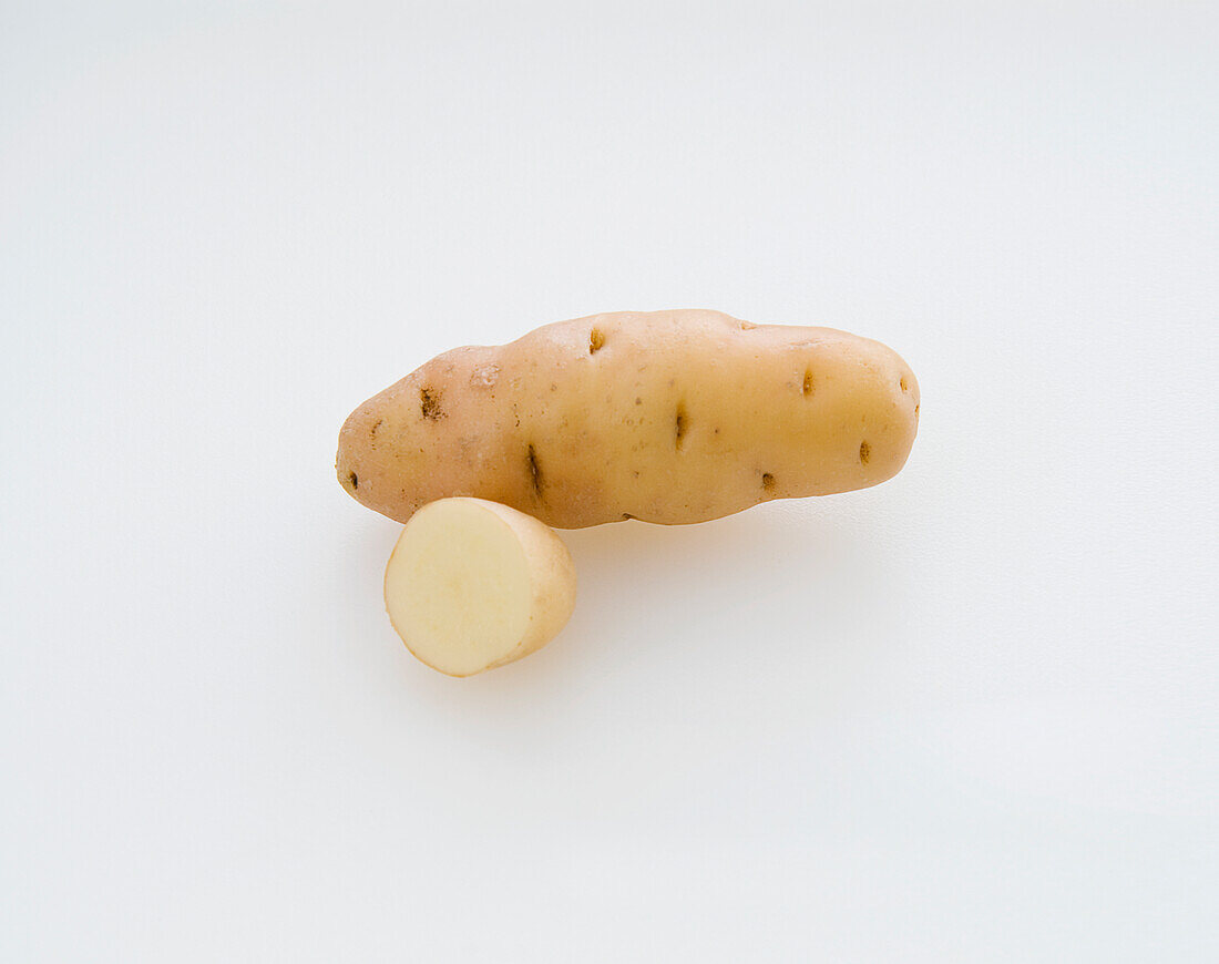 Whole and sliced Anya potato