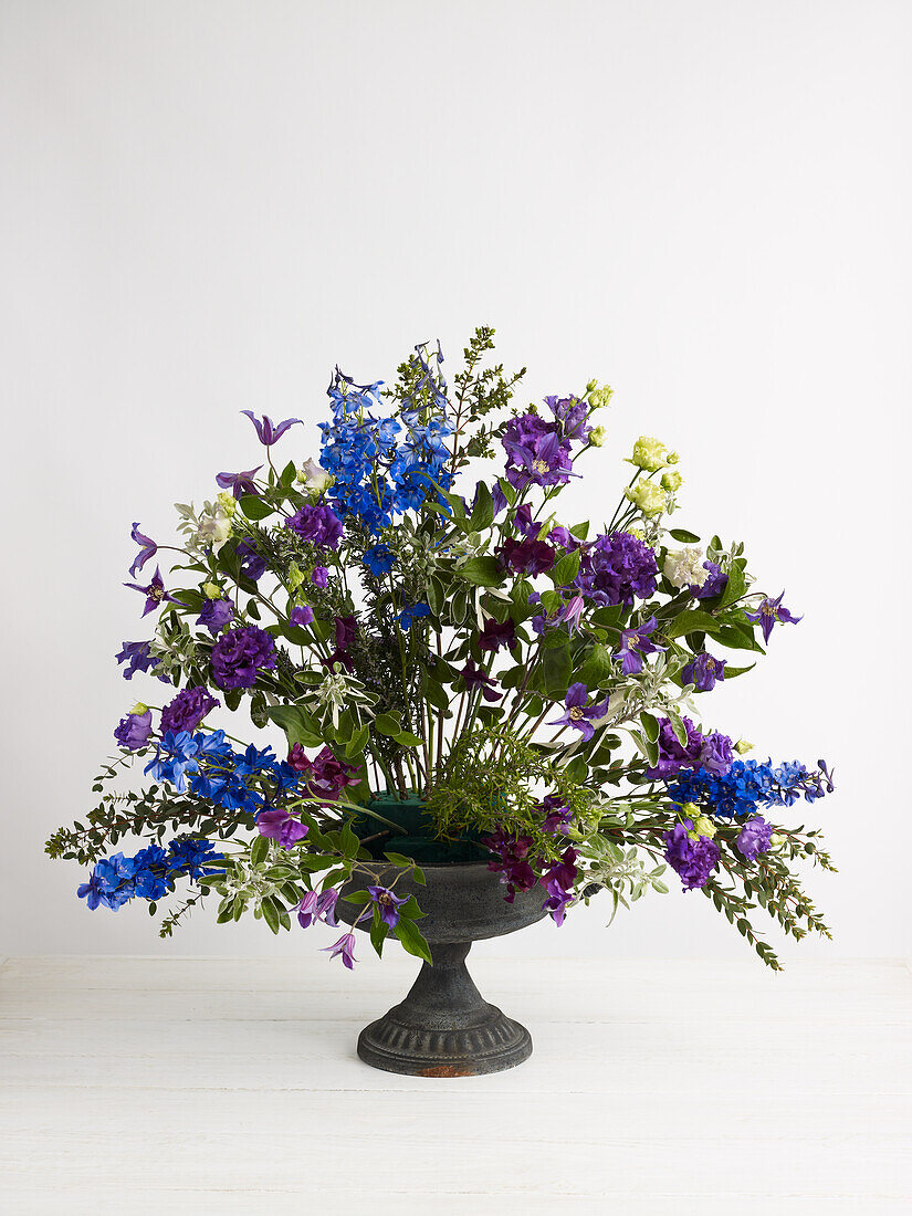 Summer flowers arrangement in urn