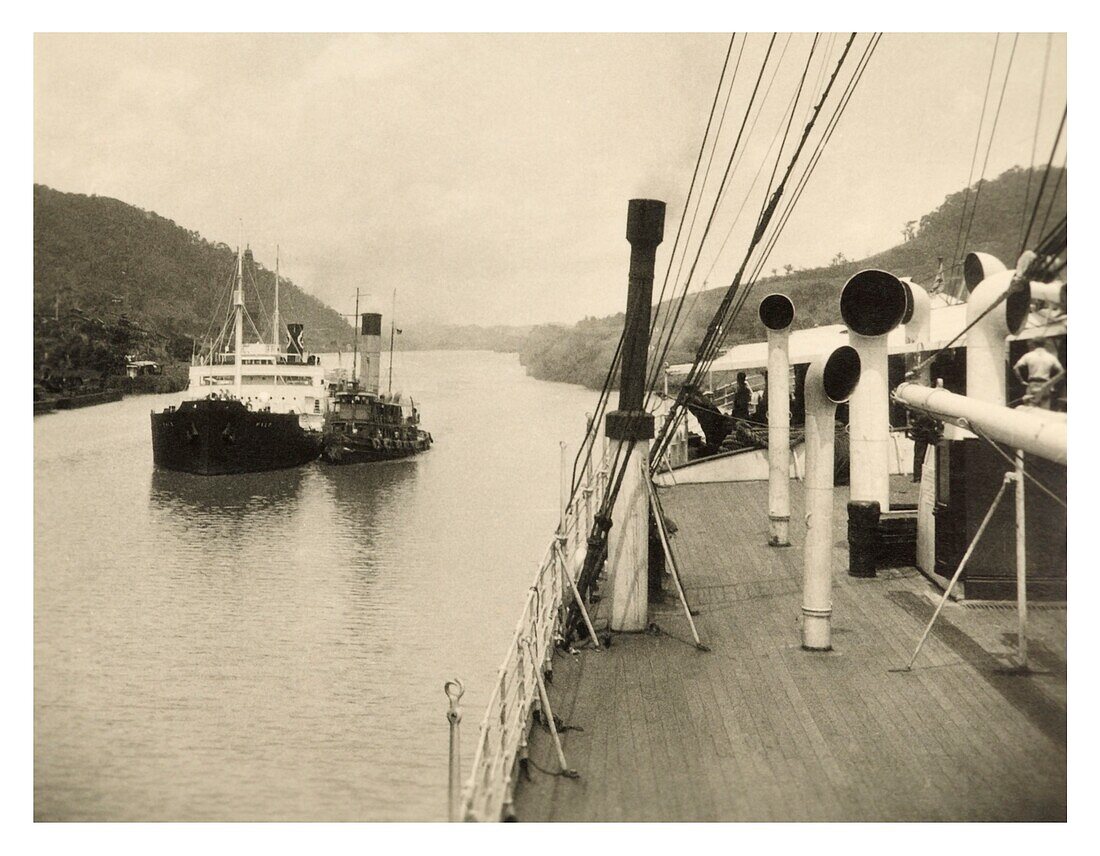 Panama canal passing ship with tug c.1930