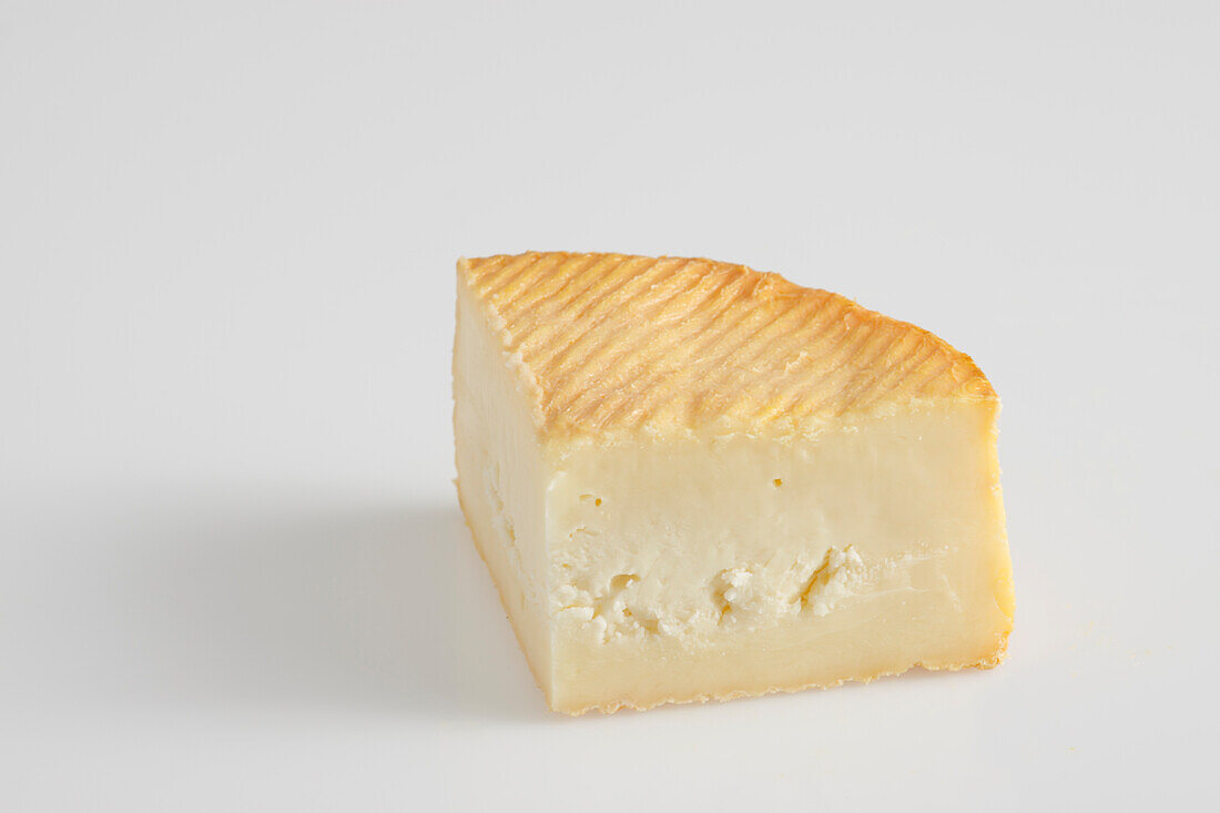 Slice of French Rollot cow's milk cheese