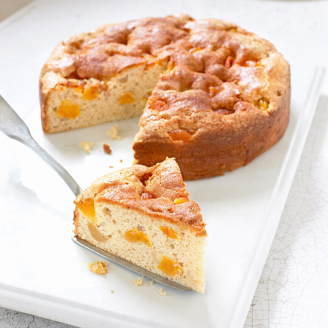 Apricot cake with single slice cut away