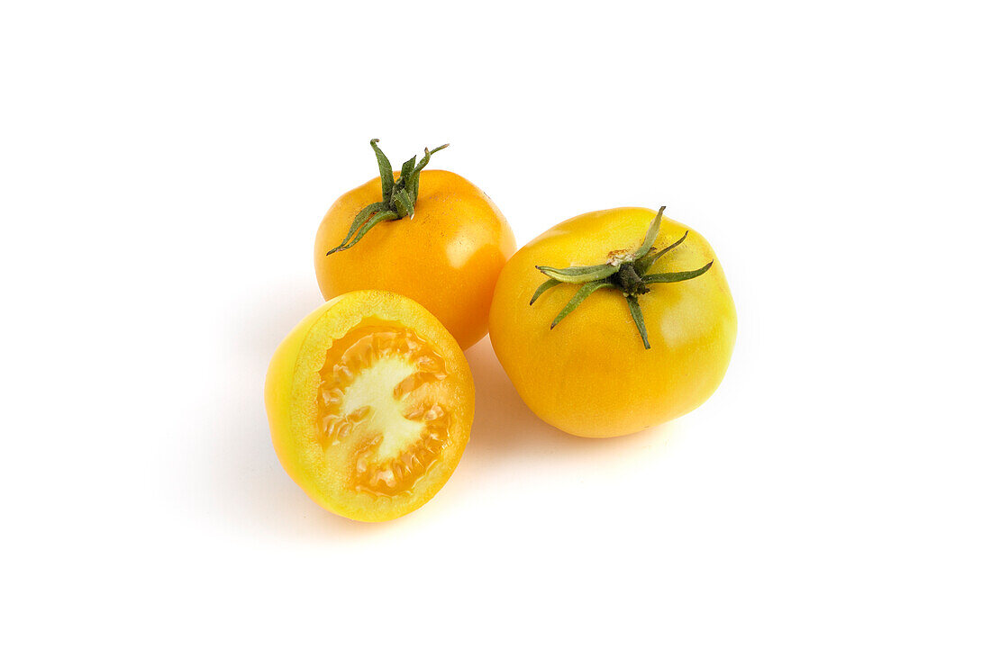Whole and sliced 'Czech's Excellent Yellow' tomatoes