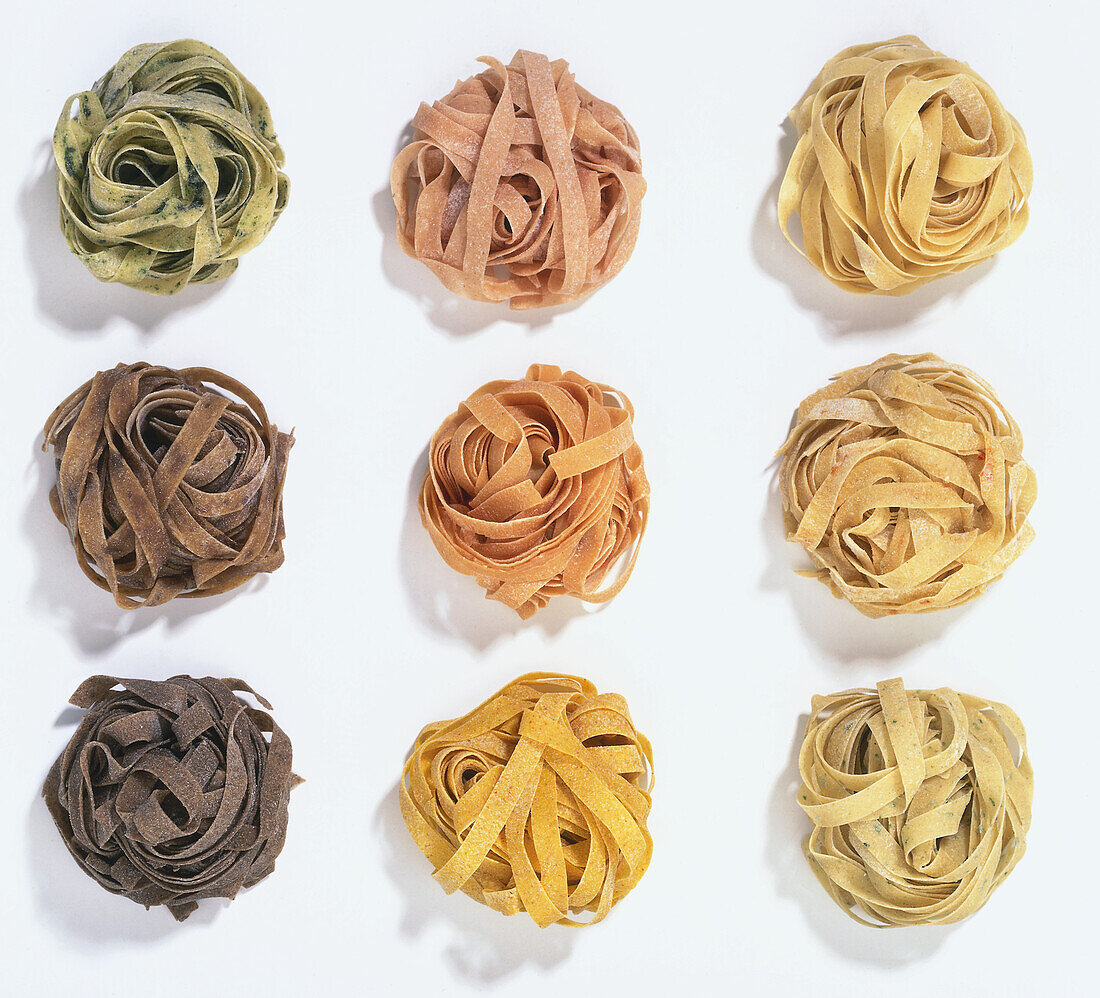 Nine balls of different coloured fresh pasta