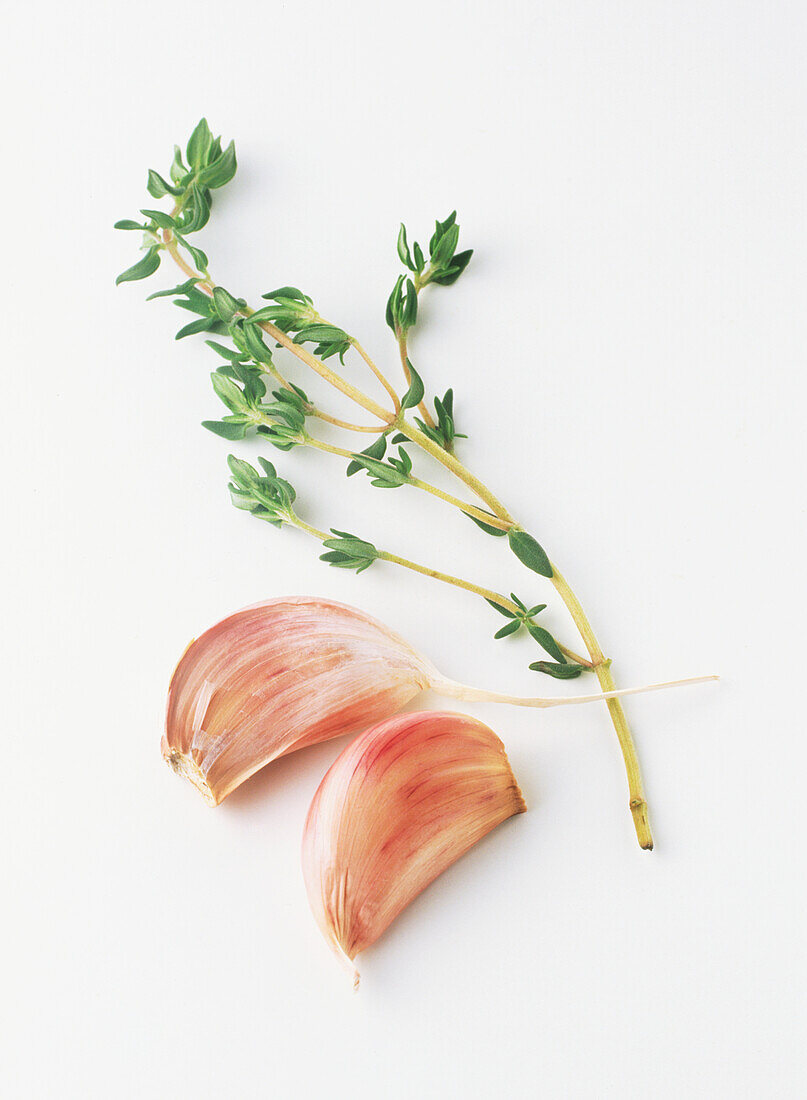 Two garlic cloves and sprig of thyme