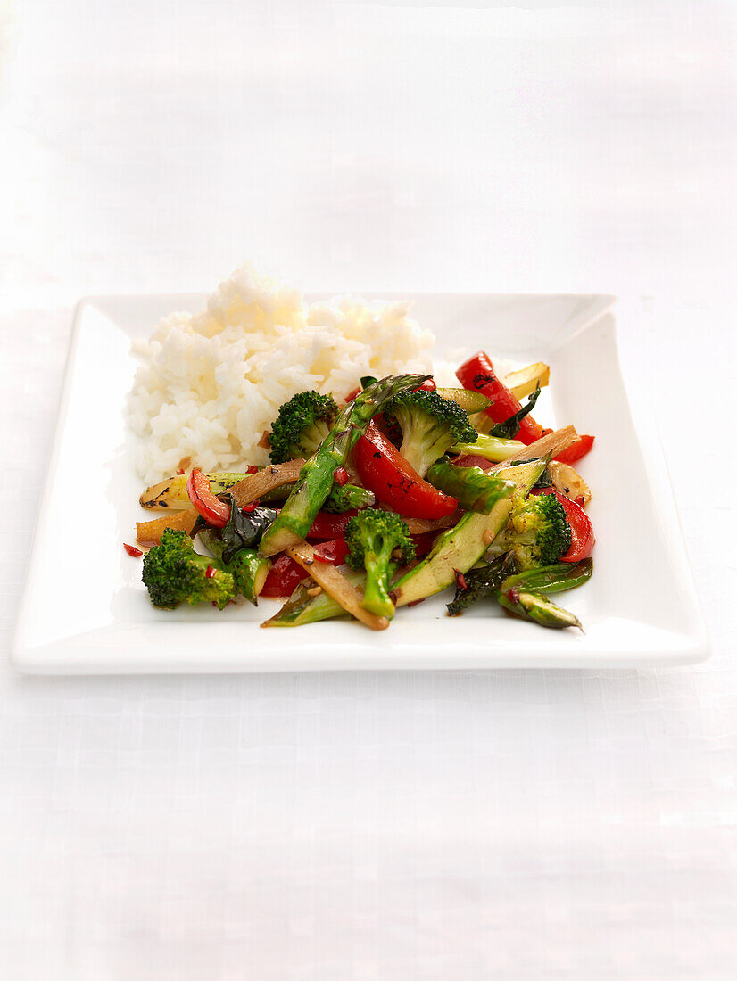 Asparagus, broccoli, ginger, and mint stir-fry with rice
