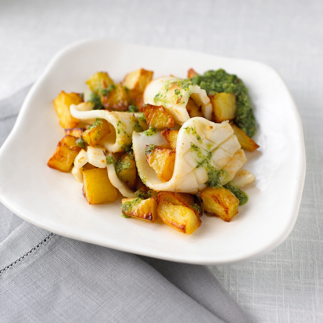Roasted squid and potato with spiced coriander pesto