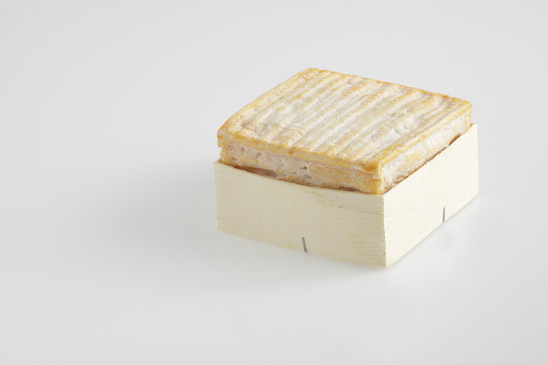 Whole square of French Pave d'Auge cow's milk cheese in box