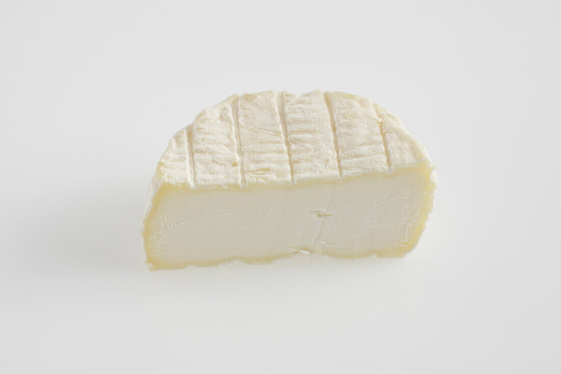 Sliced round of French Rigotte de Condrieu AOC goat's cheese