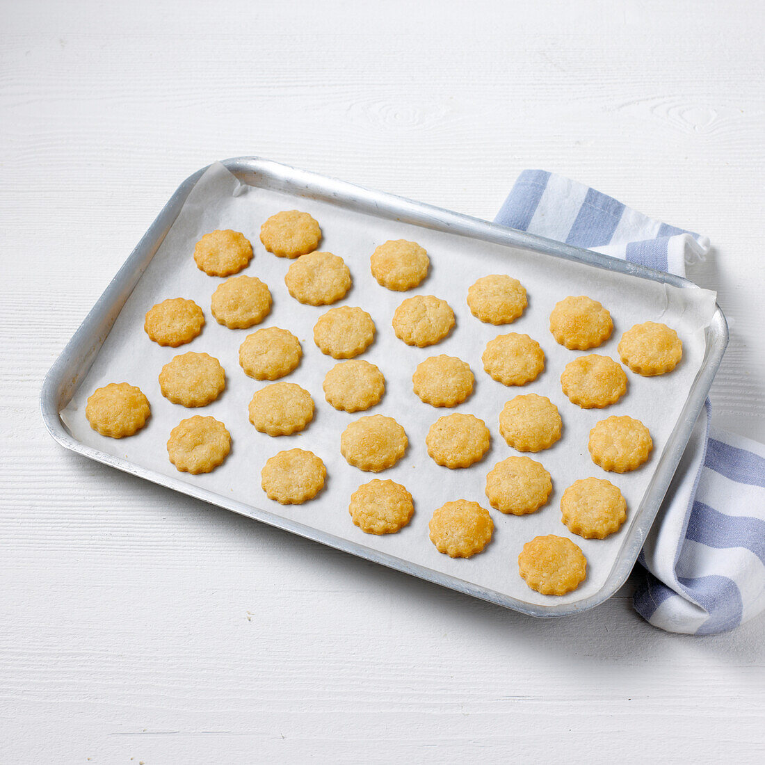 Baked parmesan shortbread canape bases on baking tray