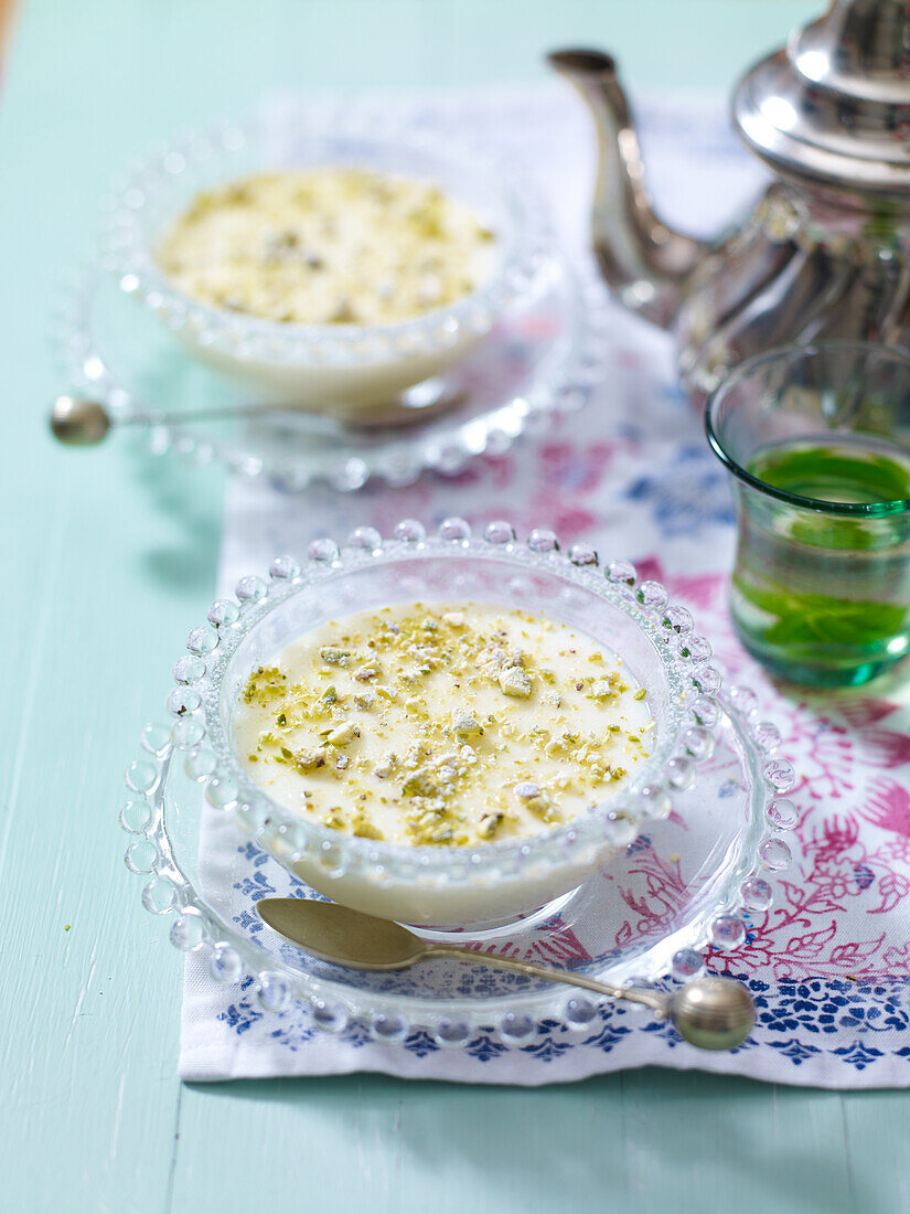 Middle Eastern milk pudding sprinkled with pistachios