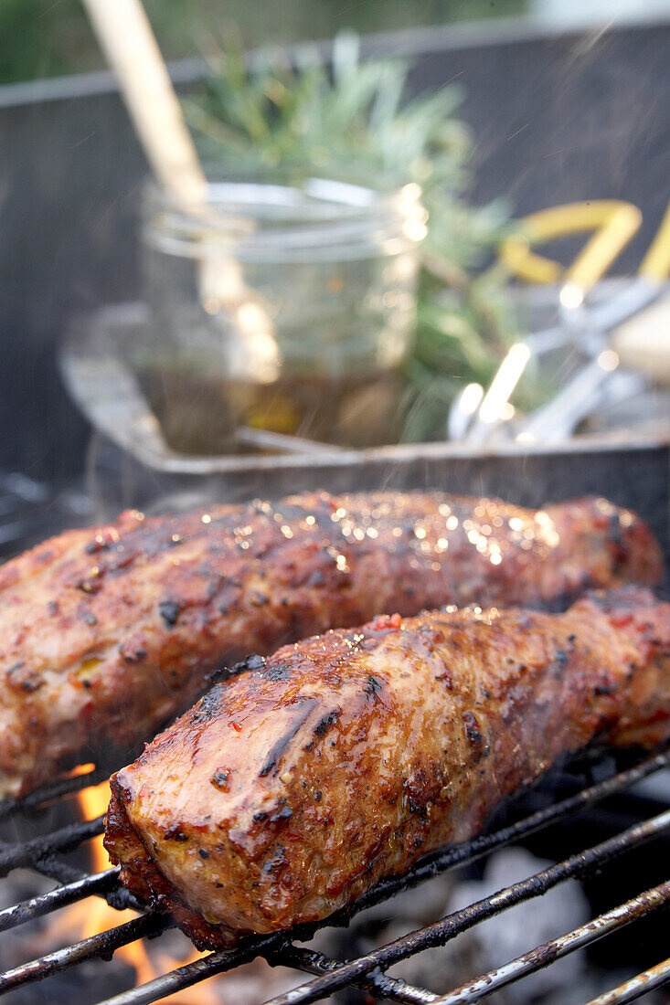 Pork tenderloins with salsa on barbeque grill