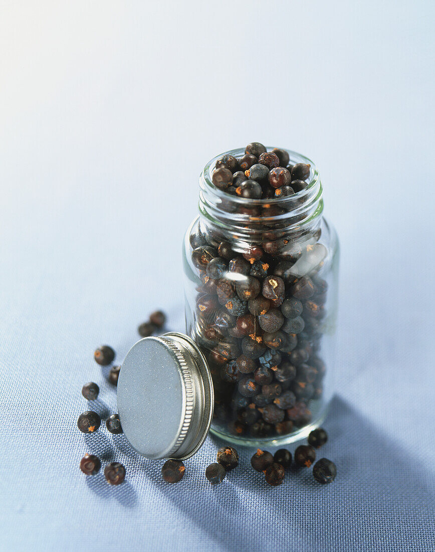 Whole dried Juniper berries in glass jar
