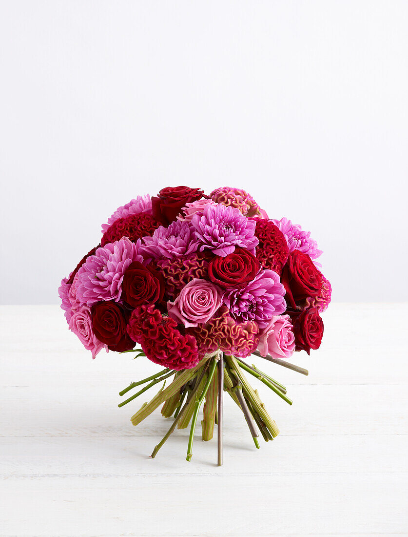 Pink and red hand tie bouquet