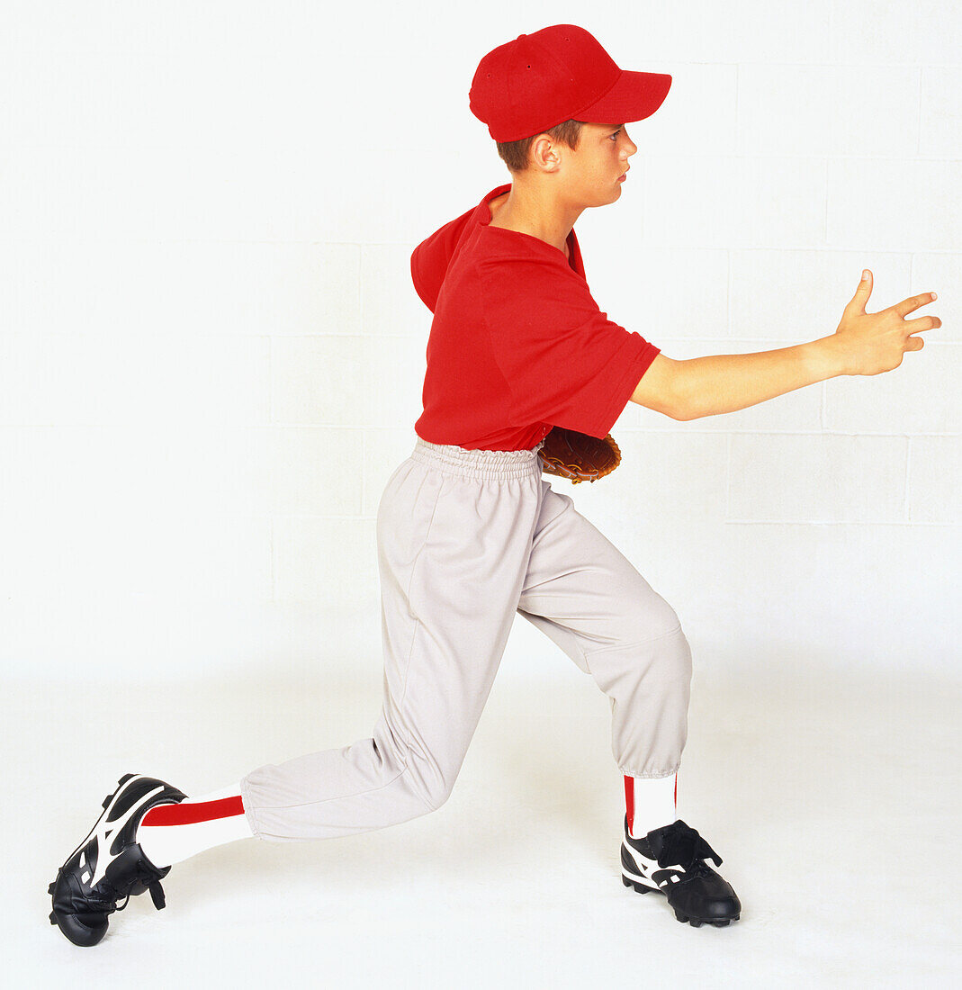 Boy wearing baseball uniform and cap