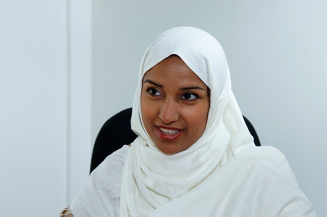 Smiling young woman in white headscarf