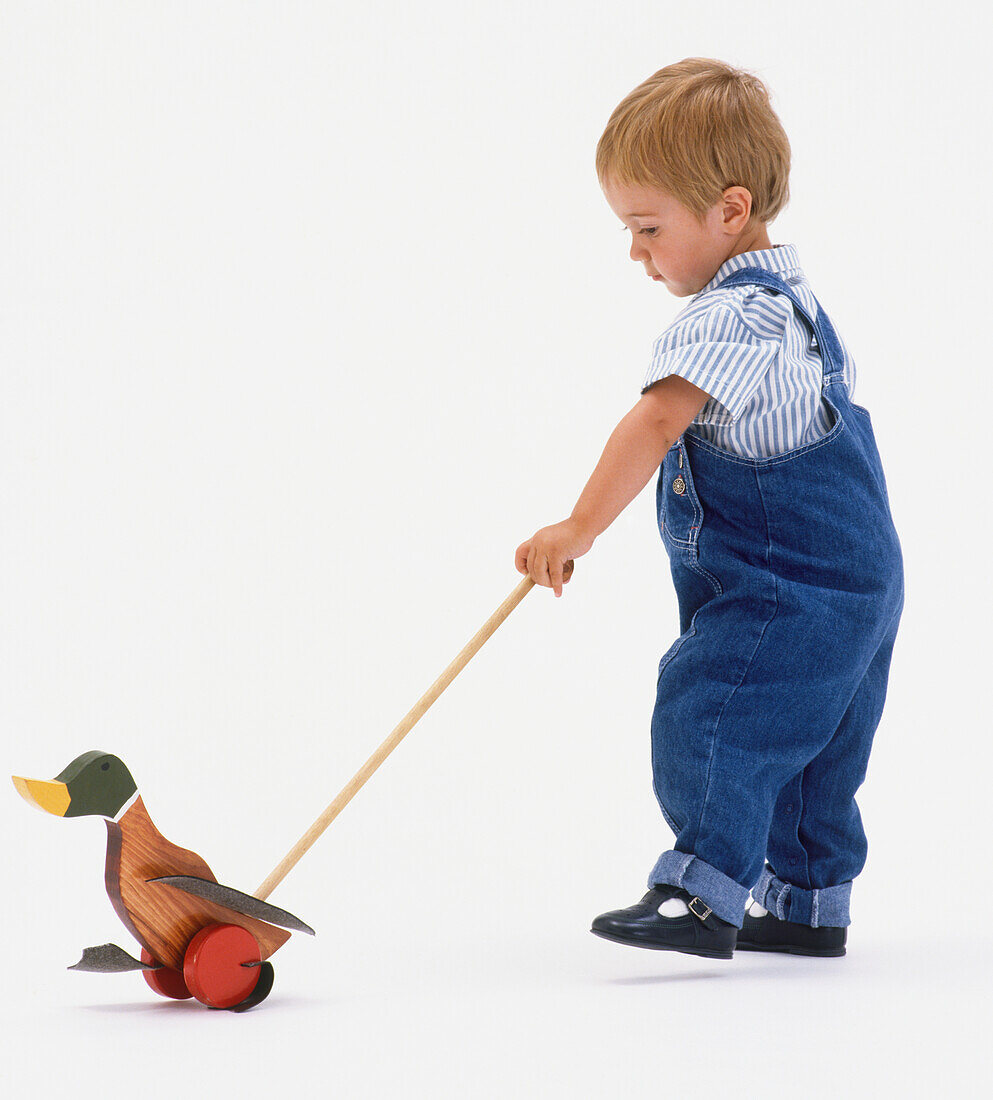 Boy with wooden duck toy