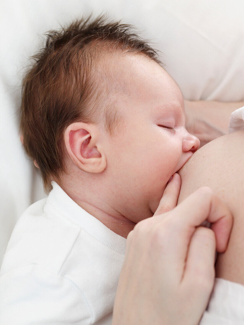 Baby girl breastfeeding