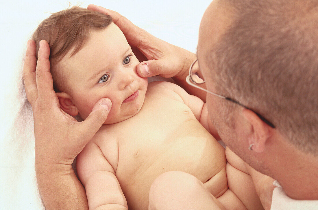 Massaging a baby's face