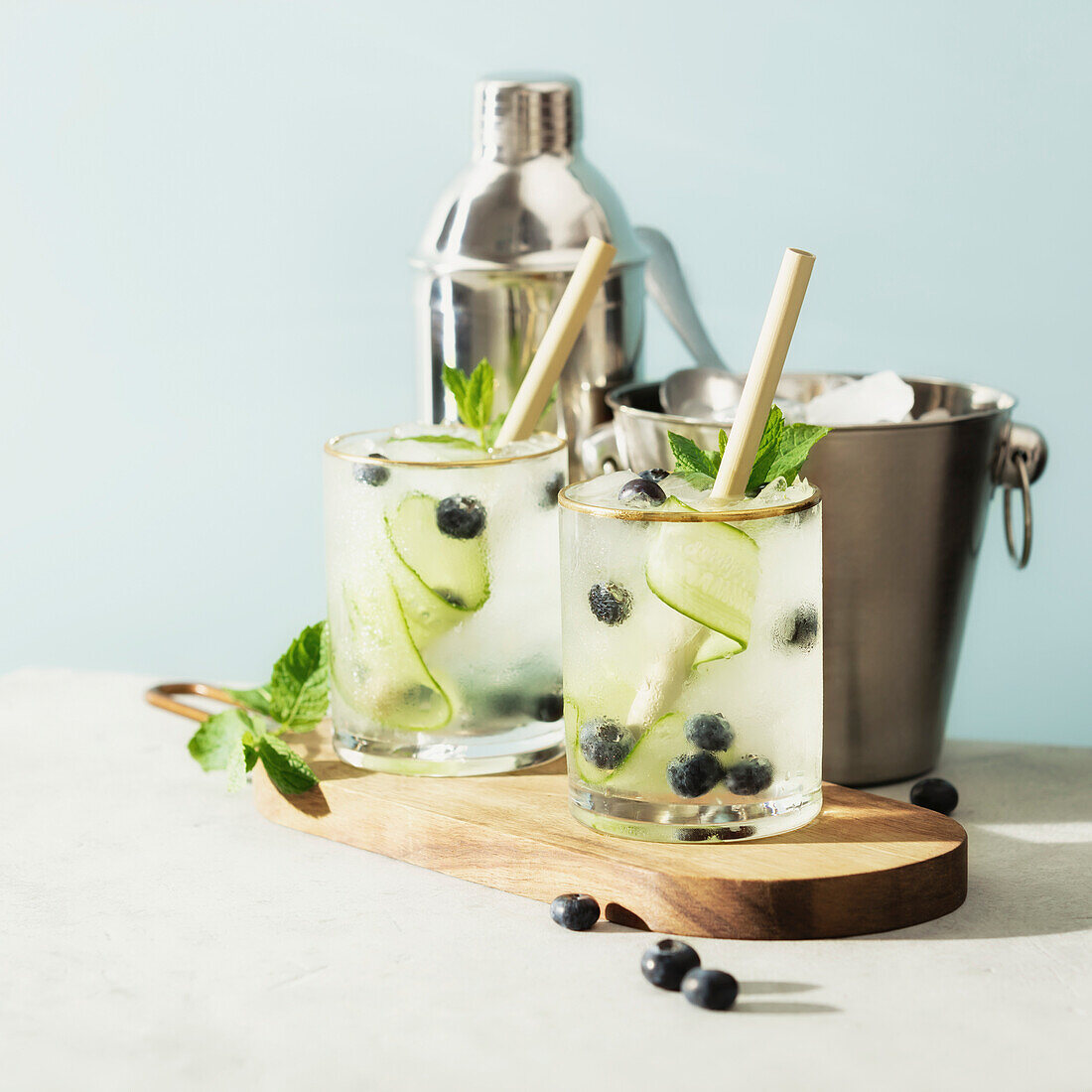 Trendy summer drinks with cucumber, mint and blueberry