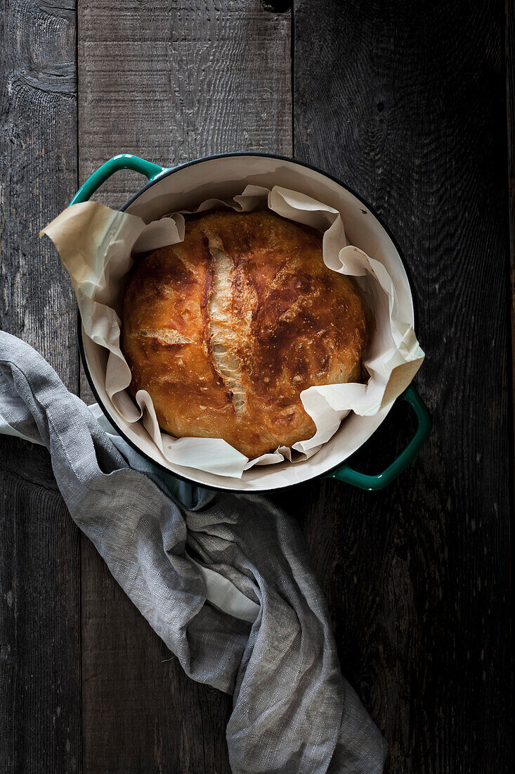 A loaf of sourdough in a dutch oven