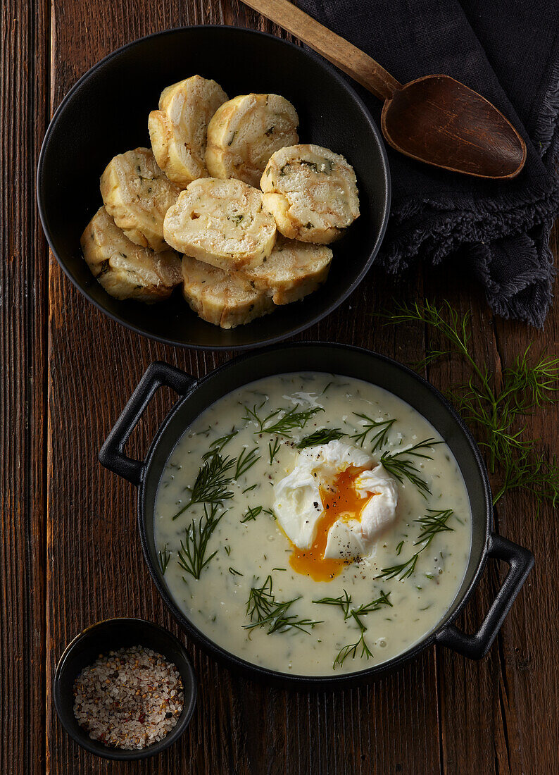 Dill sauce with poched egg and dumplings