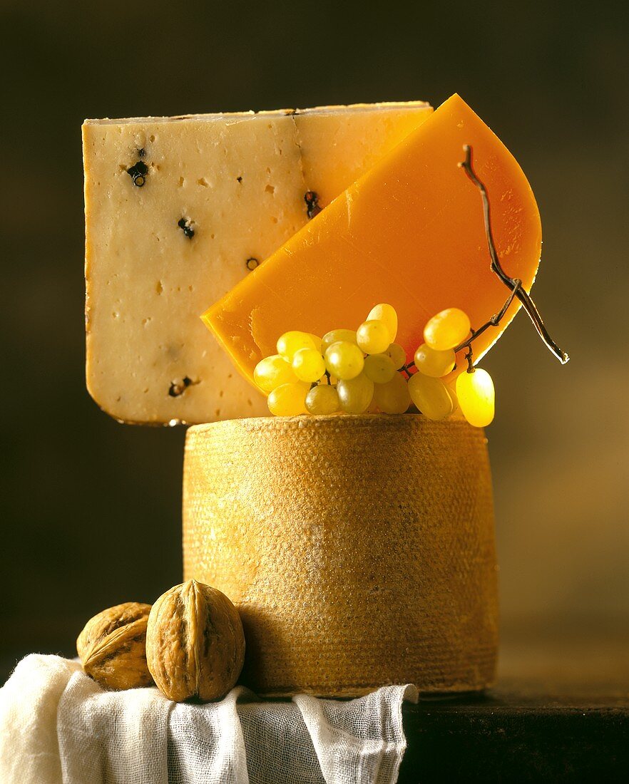 Cheese tower (three hard cheeses), walnuts & grapes