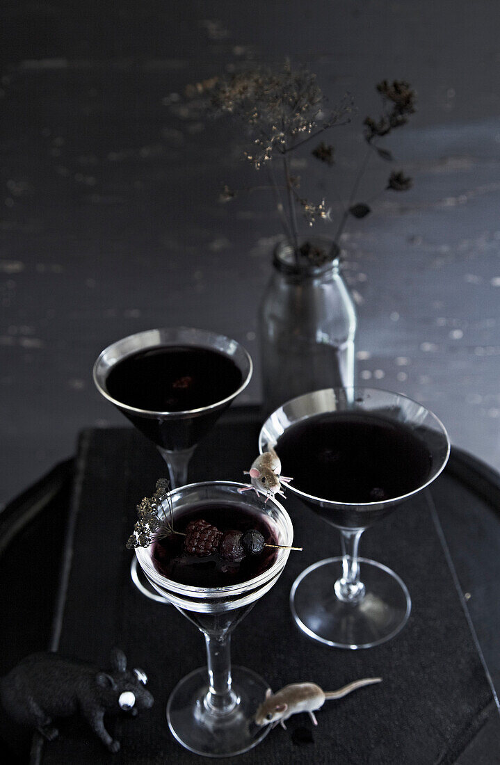 Dark cocktail and blackberries