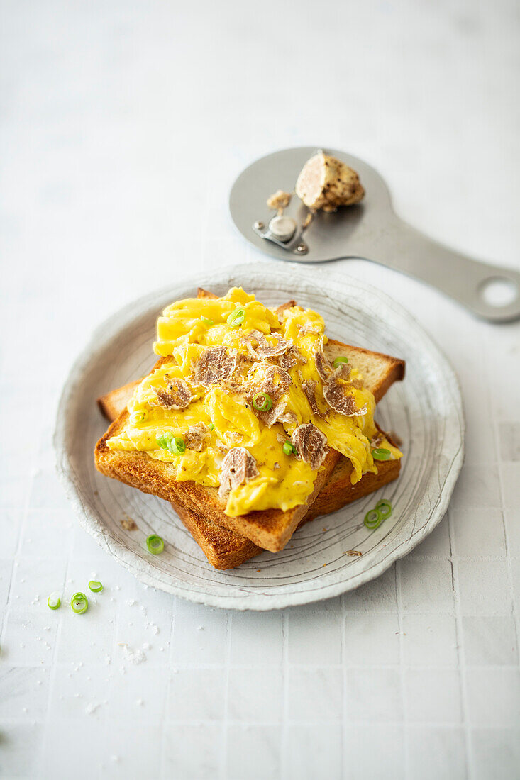 Scrambled eggs on home-baked toast with white truffle (vegetarian)