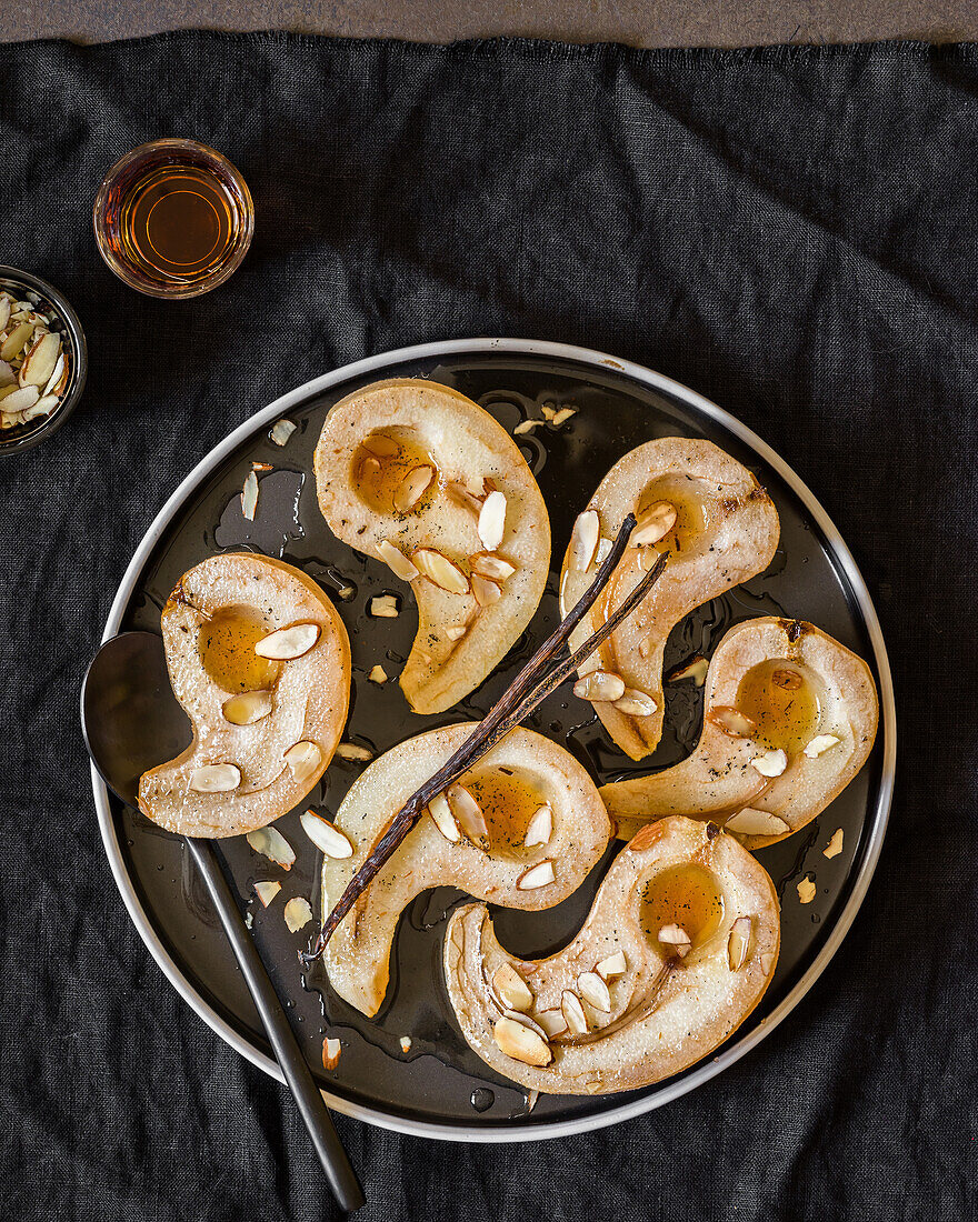 Baked pears with caramel sauce, vanilla and flaked almonds