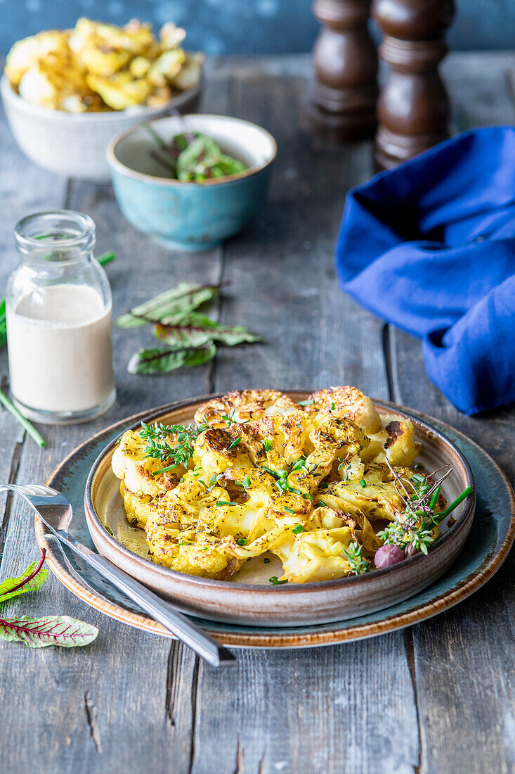 Cauliflour steak with kumin and creamy soy sauce