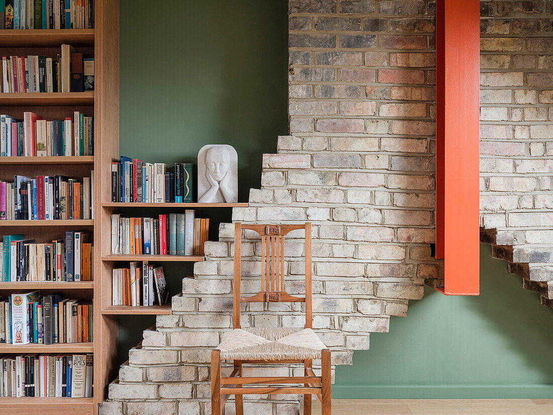 Library and study in the finished live in attic, brick detail of the surviving chimney stack