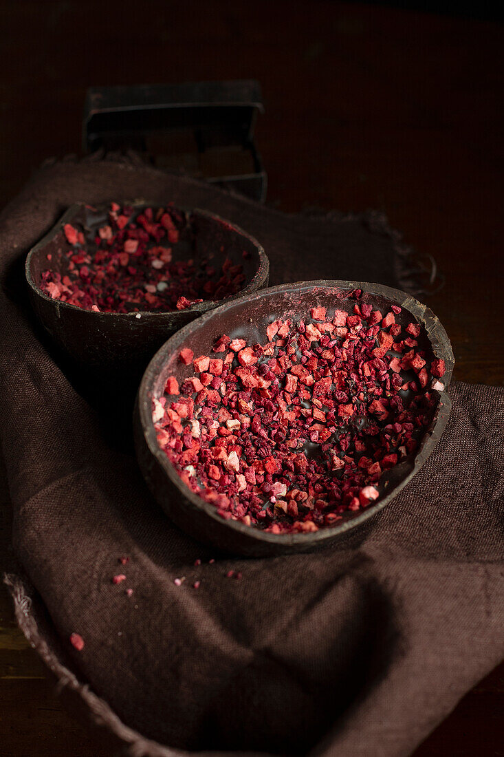 Halved Easter egg filled with dried strawberries