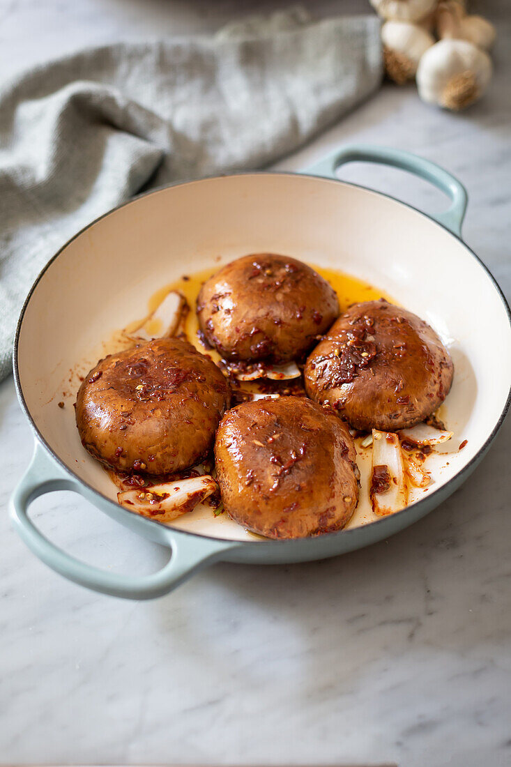 Large mushrooms in pan